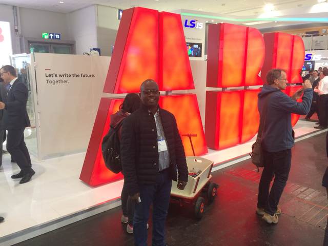At the illuminated ABB letters on the Hannover Messe show floor