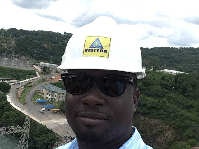 On site at the hydro dam wearing a Volta River Authority visitor hard hat