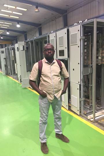 On the switchgear assembly floor beside a row of panel cubicles